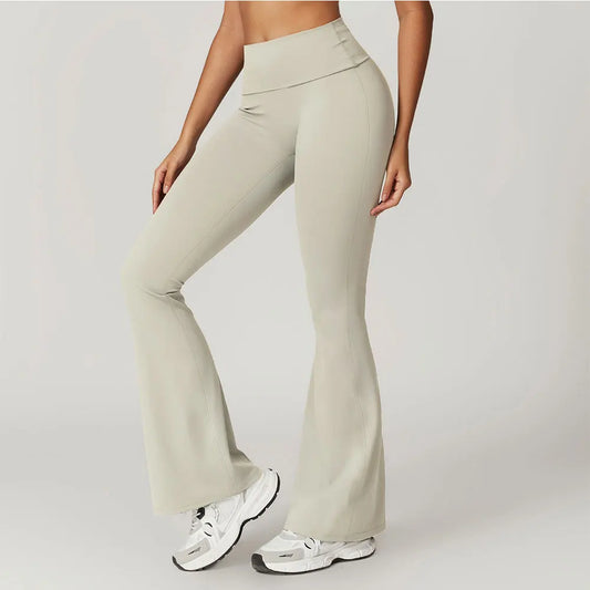 Beige flared pants worn by a person on a plain background