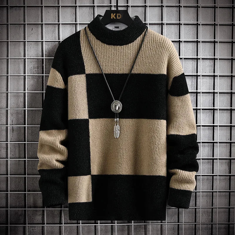 Beige and black checkered sweater with a necklace on a grid background