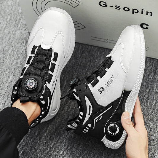 White and black sneakers with unique design elements held by a person, with a box labeled 'G-sopin' in the background.