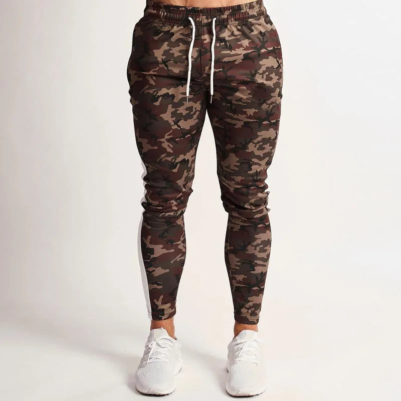 Camouflage jogger pants worn by a person on a white background