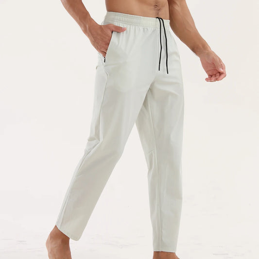 White pants with a black drawstring on a white background