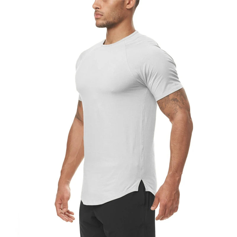 Man wearing a white athletic t-shirt on a white background