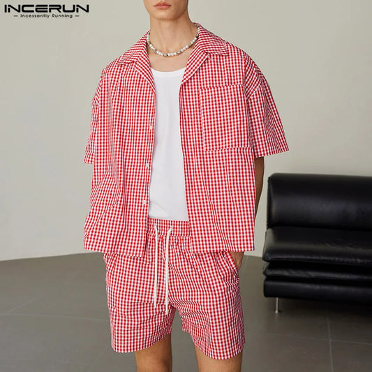 Person wearing a red and white checkered outfit with a plain background