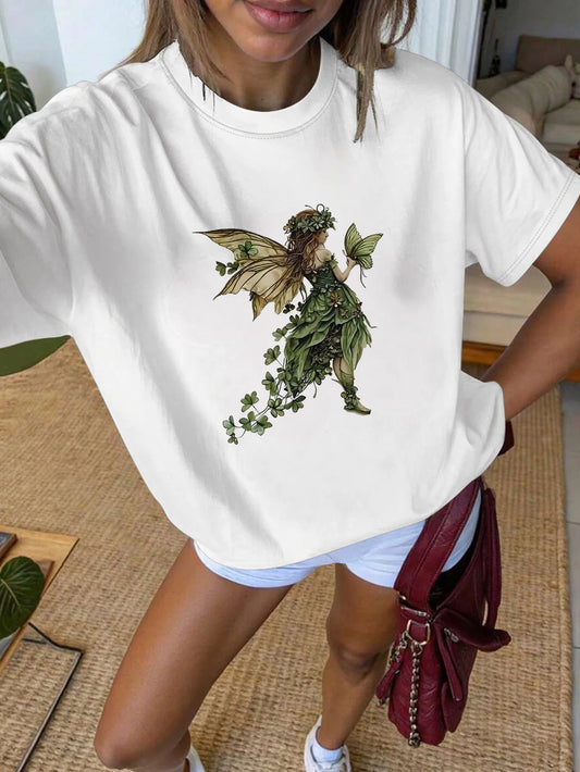 Person wearing a white t-shirt with a fairy design in a casual setting