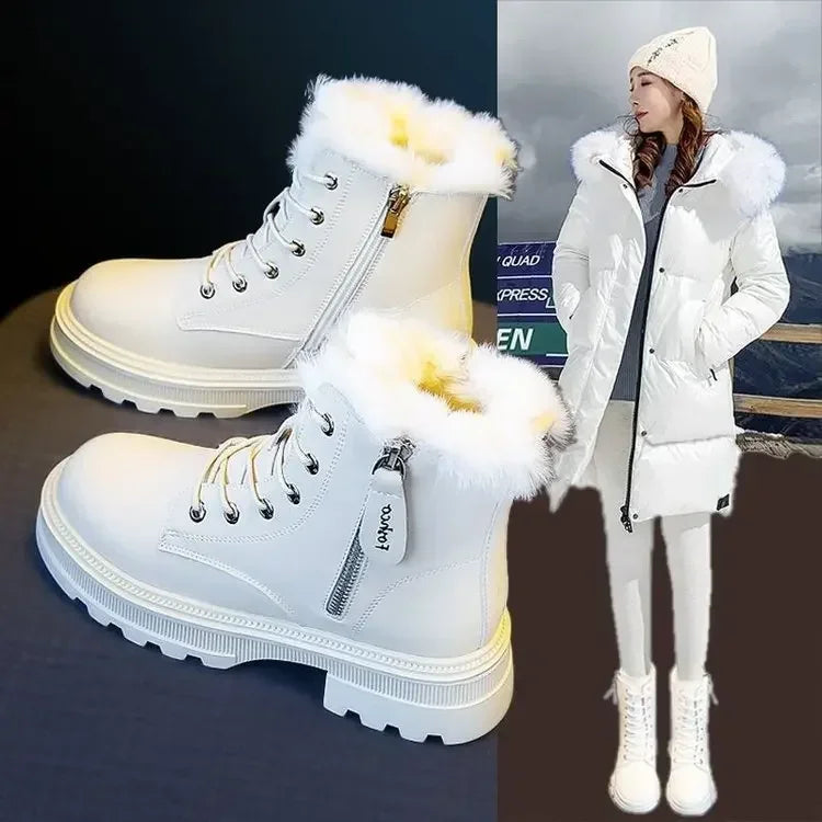 White winter boots with fur trim and a person wearing a white coat and boots in the background.