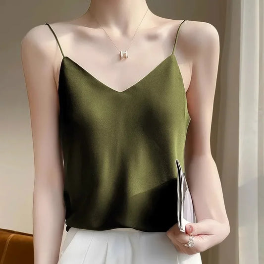 Green satin camisole worn by a mannequin against a neutral background