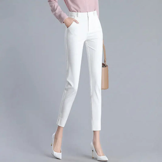 White pants worn by a person on a gray background