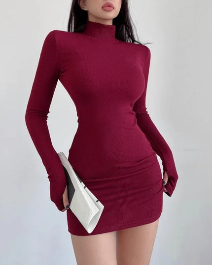 Maroon dress worn by a person on a plain background