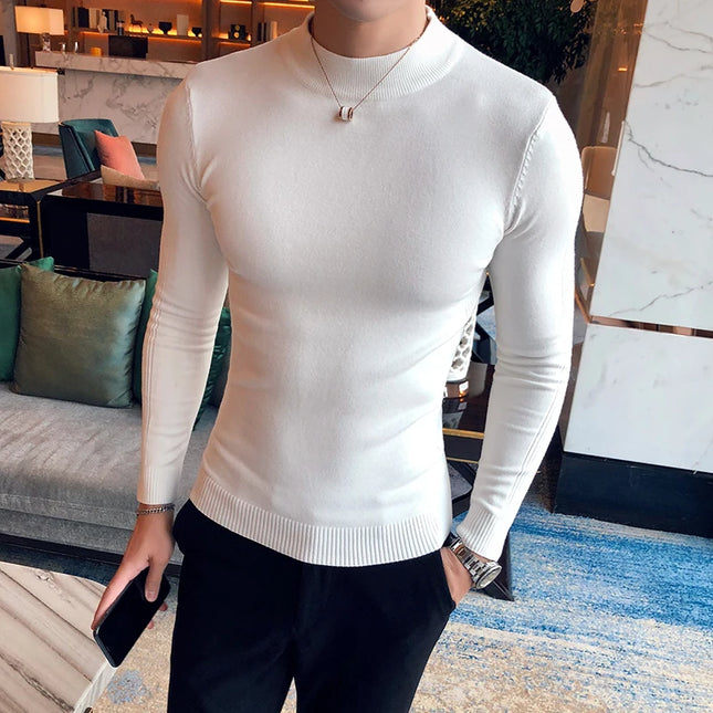 Person wearing a white long-sleeve shirt in an indoor setting