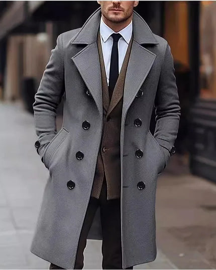 Man wearing a gray coat with a blurred city street background