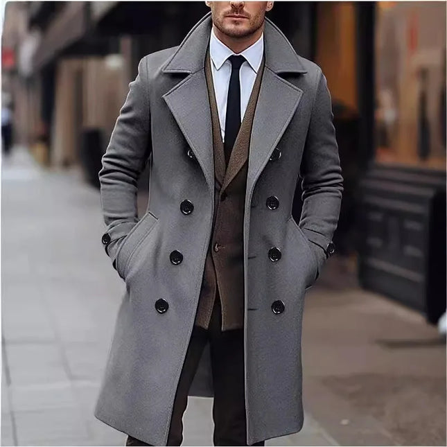Man wearing a gray coat with a blurred city street background