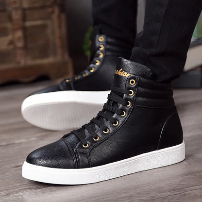 Black high-top sneakers with white soles worn by a person on a wooden floor.