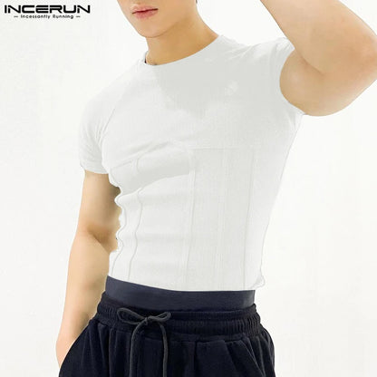 Person wearing a white t-shirt and black pants on a white background