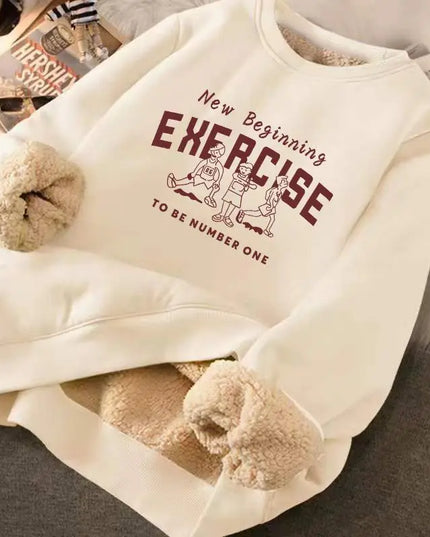 Beige fleece-lined sweatshirt with text and graphics on a surface
