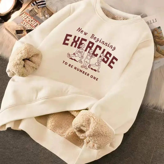Beige fleece-lined sweatshirt with text and graphics on a surface