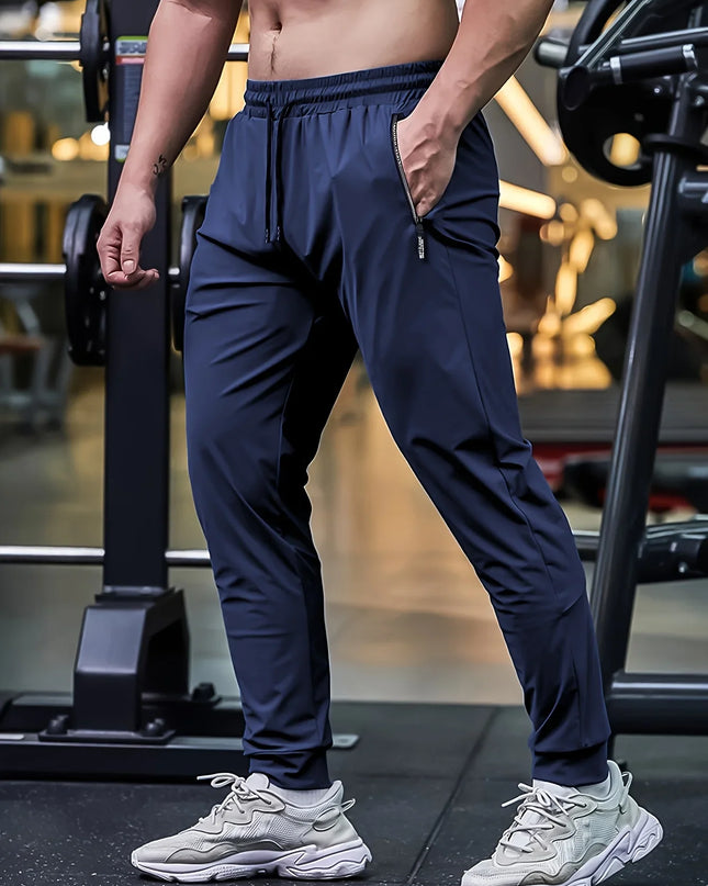 Person wearing navy blue athletic pants and white sneakers in a gym setting