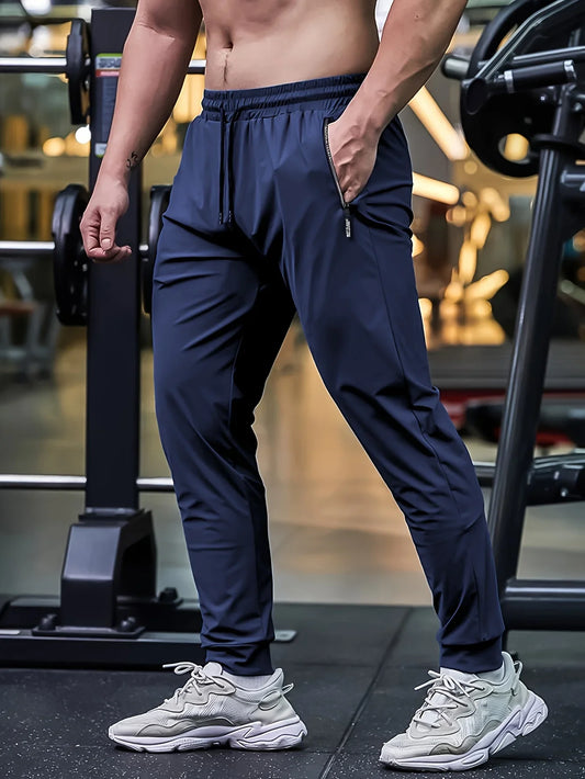 Person wearing navy blue athletic pants and white sneakers in a gym setting