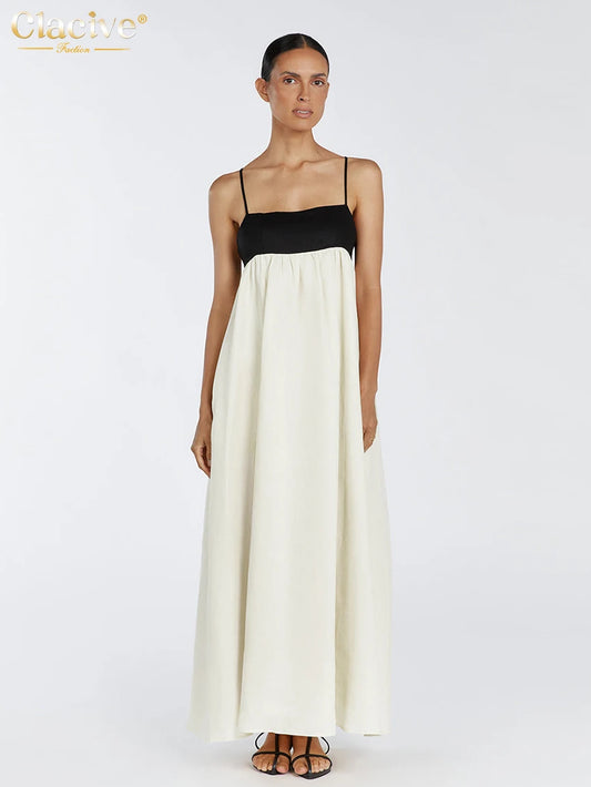 Woman wearing a black and white dress on a white background