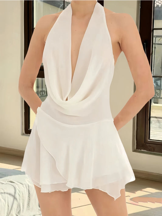 White halter neck dress worn by a person indoors.