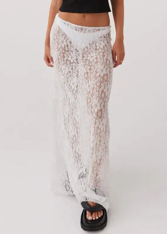 White lace skirt worn by a person on a white background