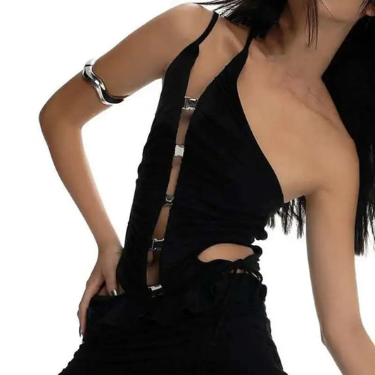 Person wearing a black dress with suspenders on a white background