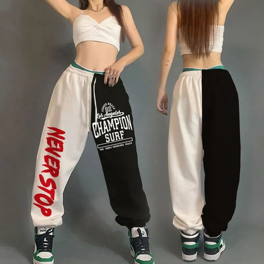 Two views of a person wearing a black and white 'Champion Surf' tracksuit with red text on a gray background.