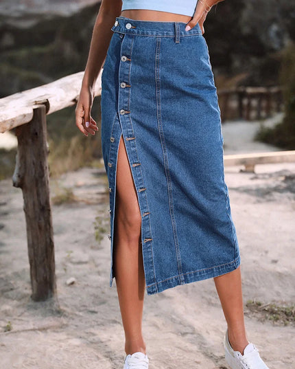 Person wearing a blue denim skirt with a blurred natural background