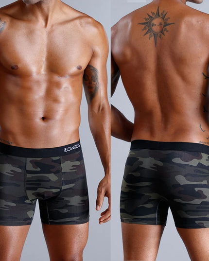 Two views of a person wearing camouflage boxer briefs on a plain background