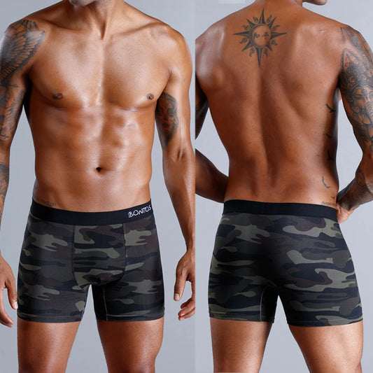 Two views of a person wearing camouflage boxer briefs on a plain background