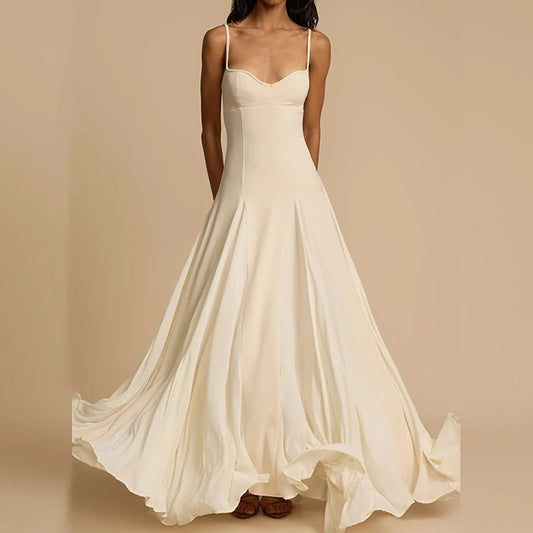 White wedding dress on a model against a beige background