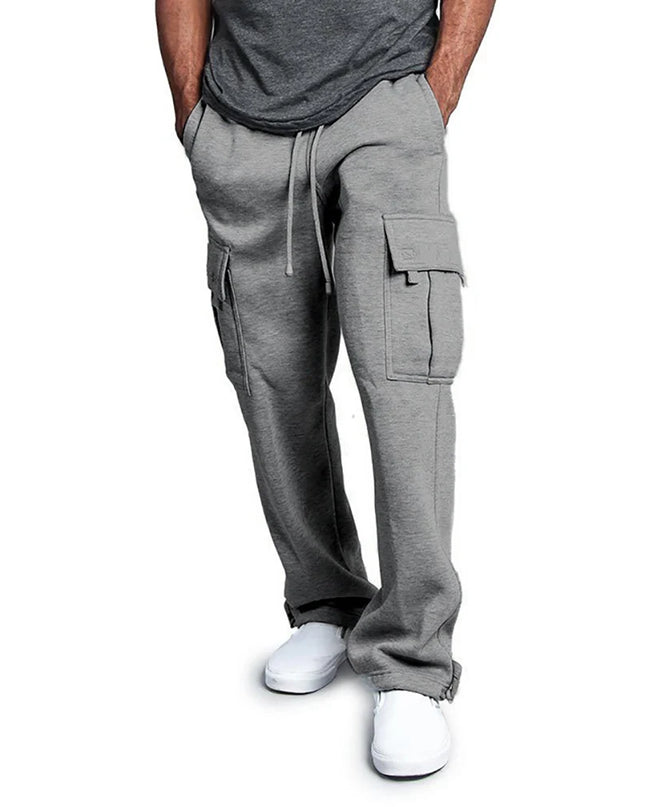 Person wearing gray cargo pants on a white background