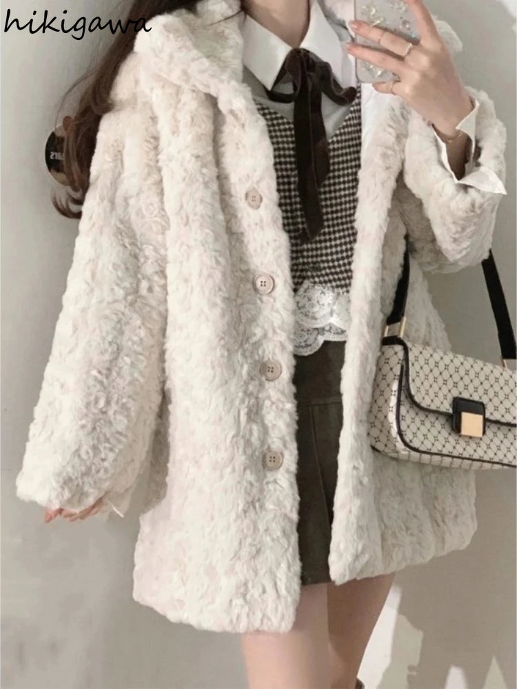 Person wearing a white fluffy coat with a checkered shirt and holding a patterned handbag.