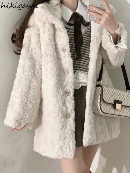 Person wearing a white fluffy coat with a checkered shirt and holding a patterned handbag.