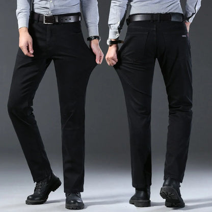 Two pairs of black pants worn by models on a gray background