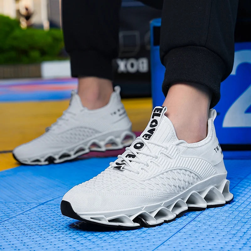 White athletic shoes with unique sole design on a colorful floor.