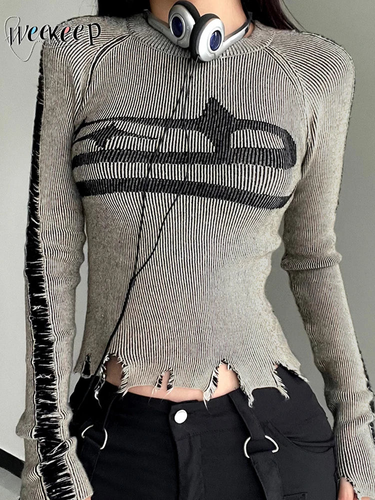 Gray sweater with black distressed design worn by a person, brand 'weareep' visible.