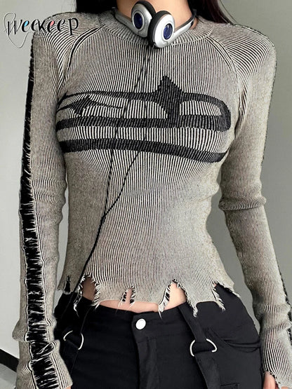 Gray sweater with black distressed design worn by a person, brand 'weareep' visible.