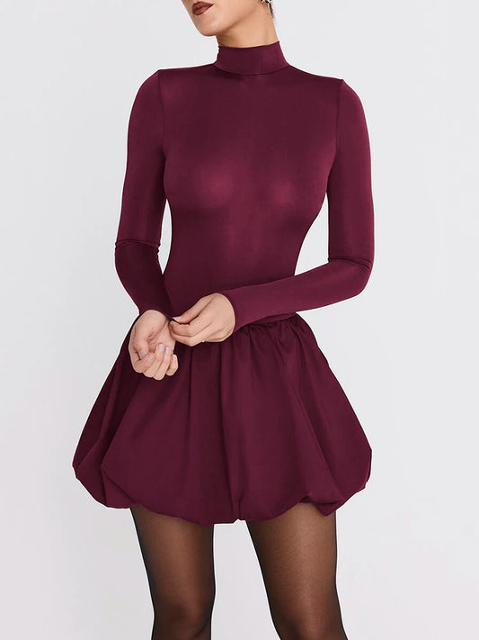 Maroon dress worn by a model on a white background