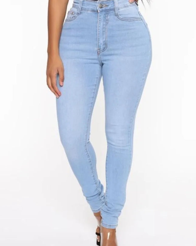 Light blue jeans worn by a person on a white background