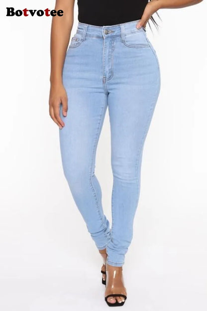 Light blue jeans worn by a person on a white background
