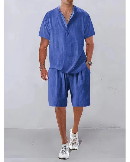 Person wearing a blue outfit with shorts and a shirt on a plain background