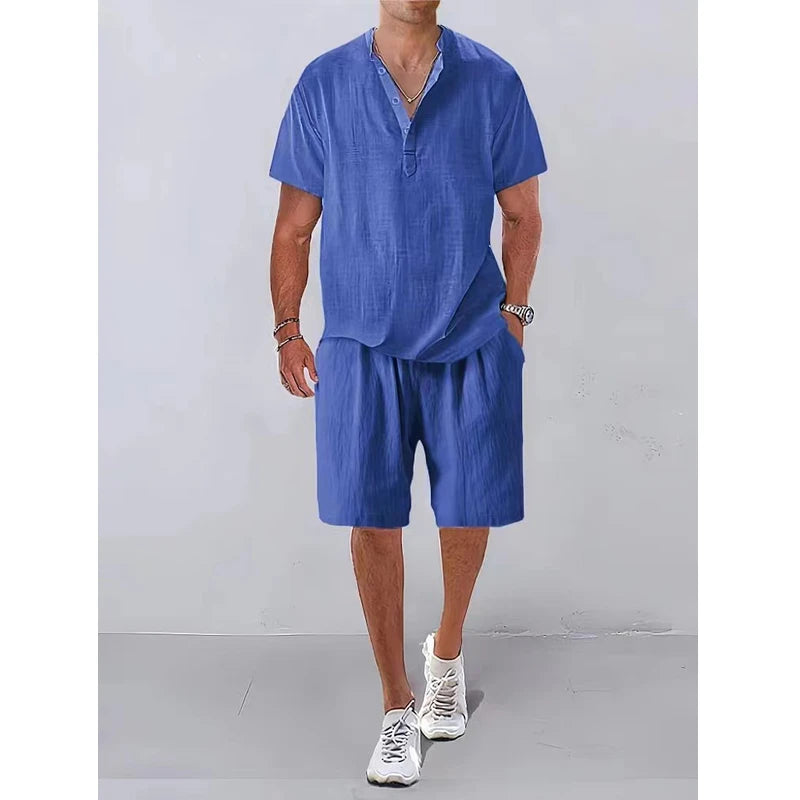 Person wearing a blue outfit with shorts and a shirt on a plain background