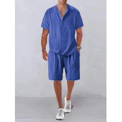 Person wearing a blue outfit with shorts and a shirt on a plain background
