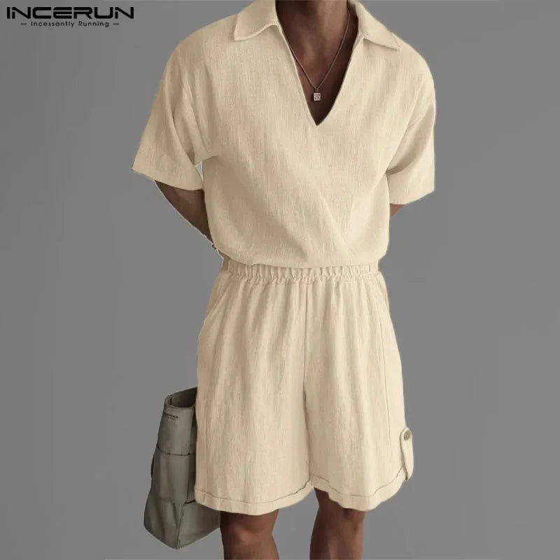Beige romper worn by a person on a gray background