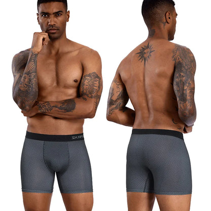 Man wearing gray boxer briefs with a brand logo, shown from front and back.