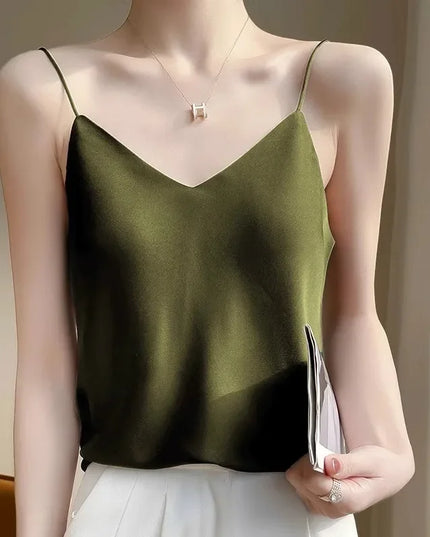 Green satin camisole worn by a mannequin against a neutral background