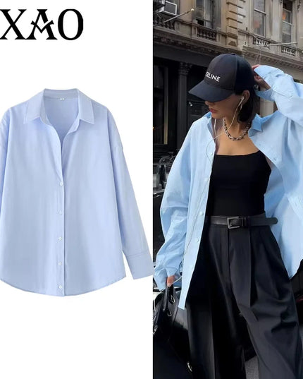 Light blue shirt on a white background with a person wearing the shirt outdoors.