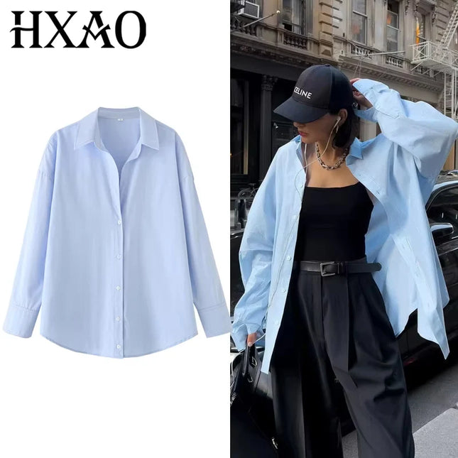 Light blue shirt on a white background with a person wearing the shirt outdoors.