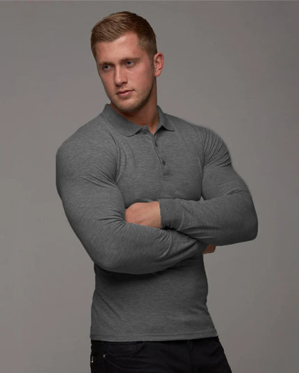 Man wearing a gray long-sleeve polo shirt against a gray background