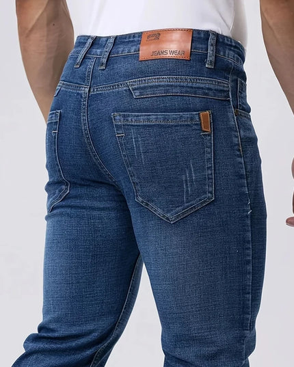 Blue jeans with a visible brand label on a white background